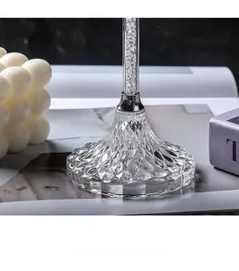 Detail of crystal glass candle holder base with diamond texture and silver metal finish
