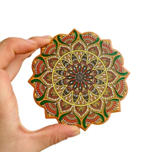 Bohemian ceramic coaster with gold-stamped mandala pattern and colorful petal edges