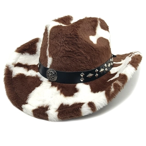 Detail of cow print cowboy hat with studded leather band and metal buckle ornament