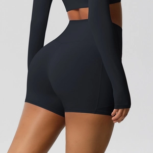 Detail view of high-waist black seamless yoga shorts with push-up effect and high elasticity