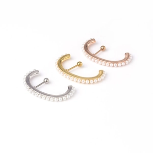 Three-piece stainless steel pearl stud earrings set in silver, gold, and rose gold finishes
