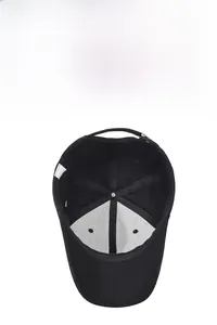 Detail of black baseball cap showing interior lining and adjustable metal buckle strap