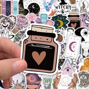 Close-up of bohemian witch stickers featuring potion bottles, crystals, and tarot designs