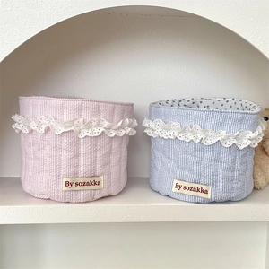 Detailed lace edge on pink and blue heart quilted baskets with soft cotton inner lining
