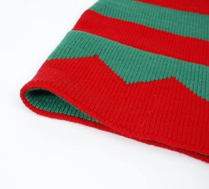 Close-up of red and green striped knit texture and ribbed pattern on Christmas hat