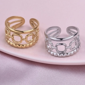 French vintage 304 stainless steel hollow rings in gold and silver on silk background