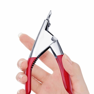 U-shaped nail tip clipper with red handle held by hand to show ergonomic usage