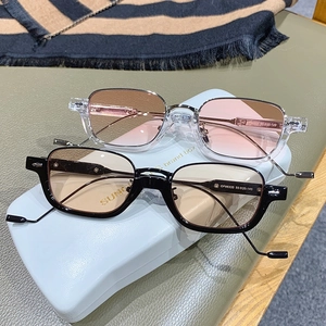 Retro rectangular sunglasses in black and transparent frames with tinted lenses
