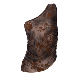 Detail view of sheer mesh fabric featuring brown branch floral flocking and side ruching