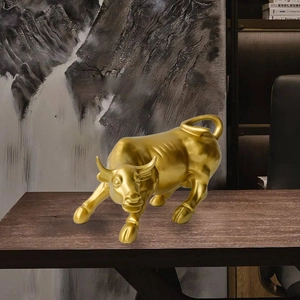 Golden bull statue on office desk for wealth and luck with minimalist bull sculpture design