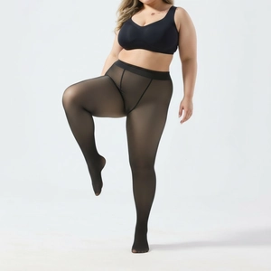 Detail of plus size black sheer tights showing high elasticity and waist fit on model