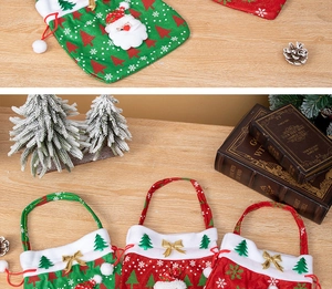 Detail of Christmas burlap gift bags with Santa Claus 3D appliques and drawstrings