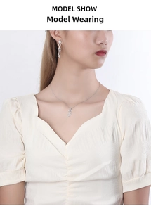 Silver leaf necklace and earrings set with zircons shown on an Asian model