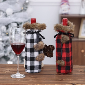 Christmas buffalo plaid wine bottle covers with faux fur trim and pom poms for table decor