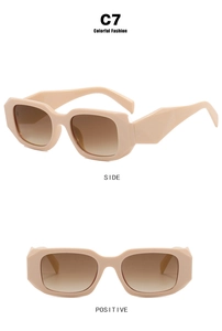 Detail view of pink rectangular sunglasses with gradient lenses and thick retro frame