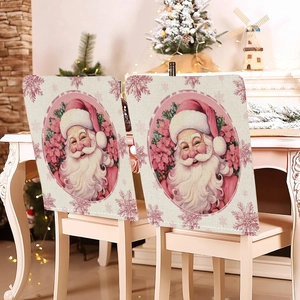 Pink Christmas chair cover featuring Santa Claus and snowflakes in a cozy home setting