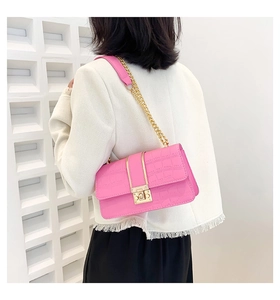 Detailed view of pink stone pattern PU leather bag with golden chain and square metal lock