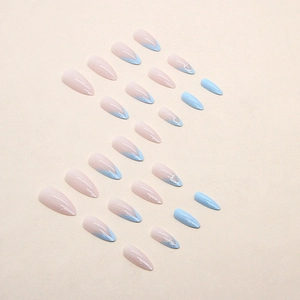 Light blue French tip almond press-on nails with nude base and silver heart detail