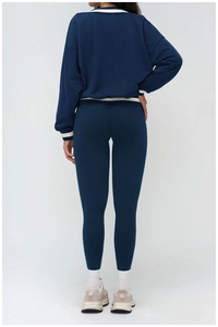 Rear view of contrast striped cuffs and hem on relaxed fit navy sports sweatshirt