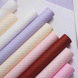 Detail of colorful honeycomb embossed decorative wrapping paper rolls for flower bouquets