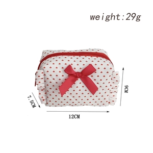 Detailed dimensions of heart print makeup bag with bow and red ruffle edges