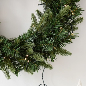 Green Christmas PE wreath with warm LED lights for home festive door decoration