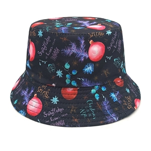 Detailed view of black bucket hat with festive Christmas text and snowflake patterns