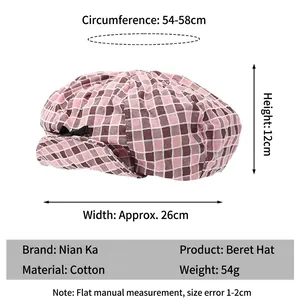 Pink plaid cotton beret hat with a small black bow accent and adjustable sizing guide