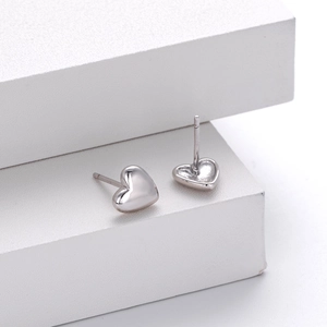 Minimalist 925 sterling silver heart stud earrings with a polished gold finish