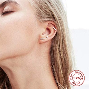 Minimalist S925 sterling silver star and bar stud earring set on model ear