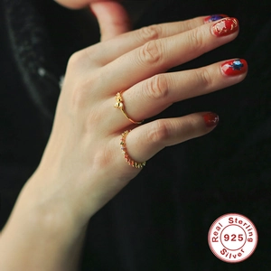 S925 sterling silver gold ring set with colorful zircons and floral charms on female hand
