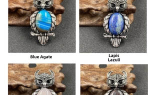 Detail of owl pendants in blue agate, lapis lazuli, rose quartz, and picture stone