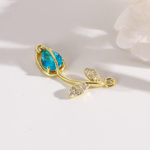 Detail of tulip connector with blue gemstone and rhinestones for DIY jewelry making