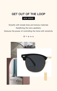 Detail of retro half-frame sunglasses with gold metal temples and dark grey polarized lenses