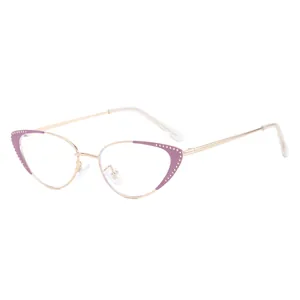Stylish cat-eye glasses with golden metal frames and purple rhinestone brow accents