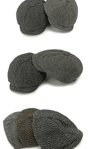 Detailansicht von Vintage-Schiebermützen aus Tweed mit Fischgräten- und Fischschwanzmuster