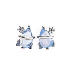 Detail of 925 sterling silver rocket stud earrings with light blue gems and white zircons