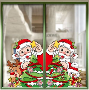 Detailed view of cartoon Christmas window stickers on glass with Santa and reindeer