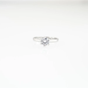 Classic silver titanium steel ring featuring a round moissanite in a six-prong setting