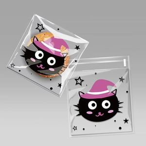 Detail of Halloween self-adhesive cookie bags with purple hat black cat and star patterns