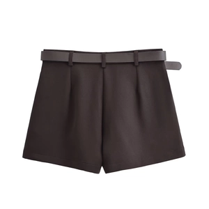 Detail of dark brown suit shorts featuring matching waist belt and metal buckle
