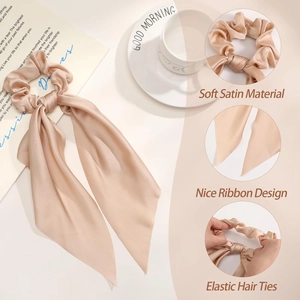 Detail of soft champagne satin hair scrunchie with long ribbon and elastic tie