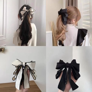 Elegant large satin bow banana clip hair accessory in black and white for women