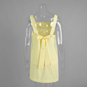 Detail of the yellow summer two-piece set featuring a back lace-up bow and cut-out design