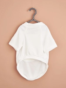 Detailed view of white mesh pet t-shirt with pearl hanger on neutral background