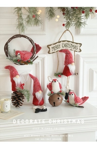 Close-up of festive knitted felt gnomes and brown pine cones for Christmas decor