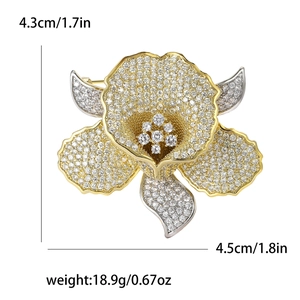Detailed view of luxury flower brooch with size measurements 4.3cm x 4.5cm and weight info
