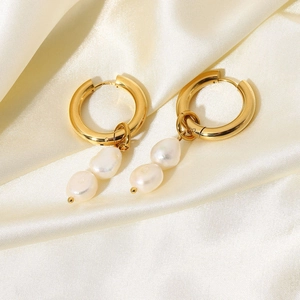 Detail view of 18K gold plated hoop earrings with double baroque freshwater pearl charms