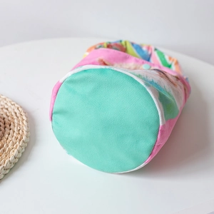 Cartoon floral print bucket bag with mint green bottom and pink canvas stitching