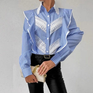 Detailed view of white lace collar and V-shaped lace stitching on blue striped shirt